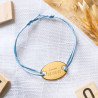 Bracciale in oro placcato inciso con corda di raso blu